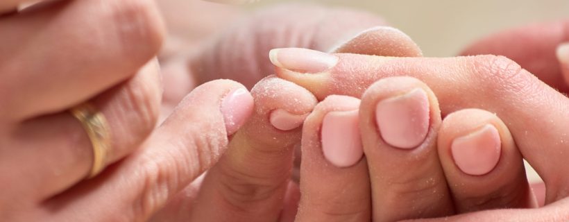 Manicurist making hardware manicure. Manicure device remove the cuticle. Process hardware mechanical manicure.